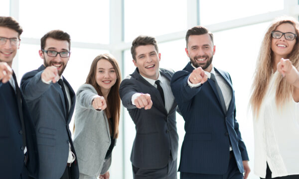 happy business team pointing