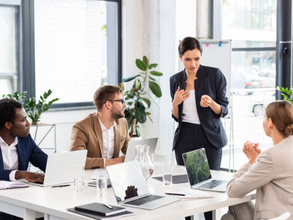 business people sitting inside a conference room