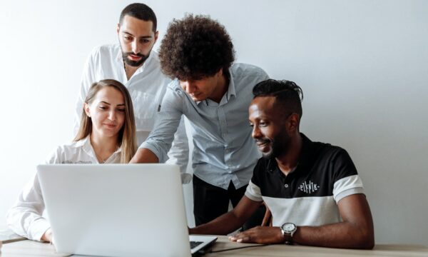 team working looking at the laptop